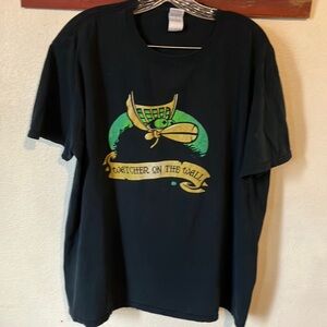Watchers on the Wall Graphic Tee
Black‎ with Green and Gold